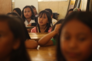 Two images of students in schools with strong family engagement strategies.
